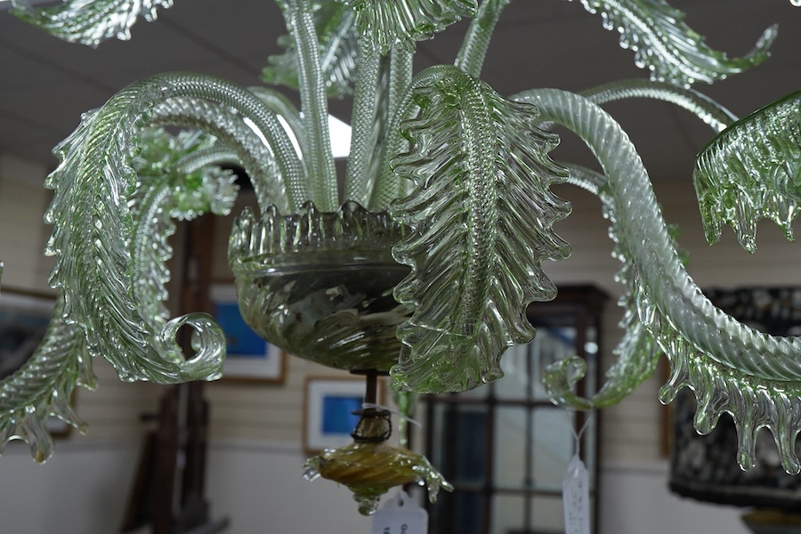 An ornate leaf and floral green glass Murano three branch chandelier, 84cm high.